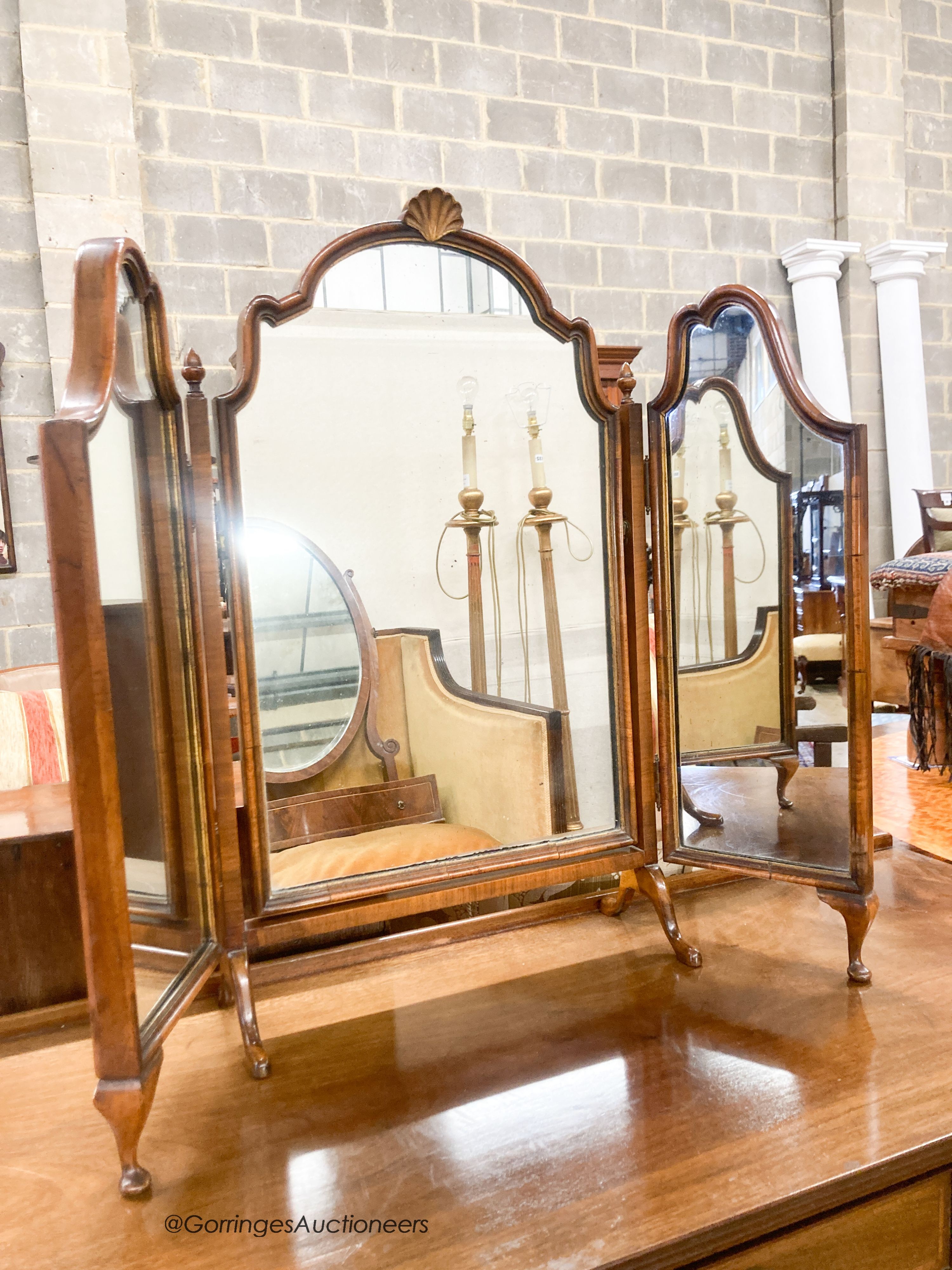 An early 20th century Georgian style mahogany dressing table, width 122cm, depth 49cm, height 77cm together with a Queen Anne style dressing table mirror